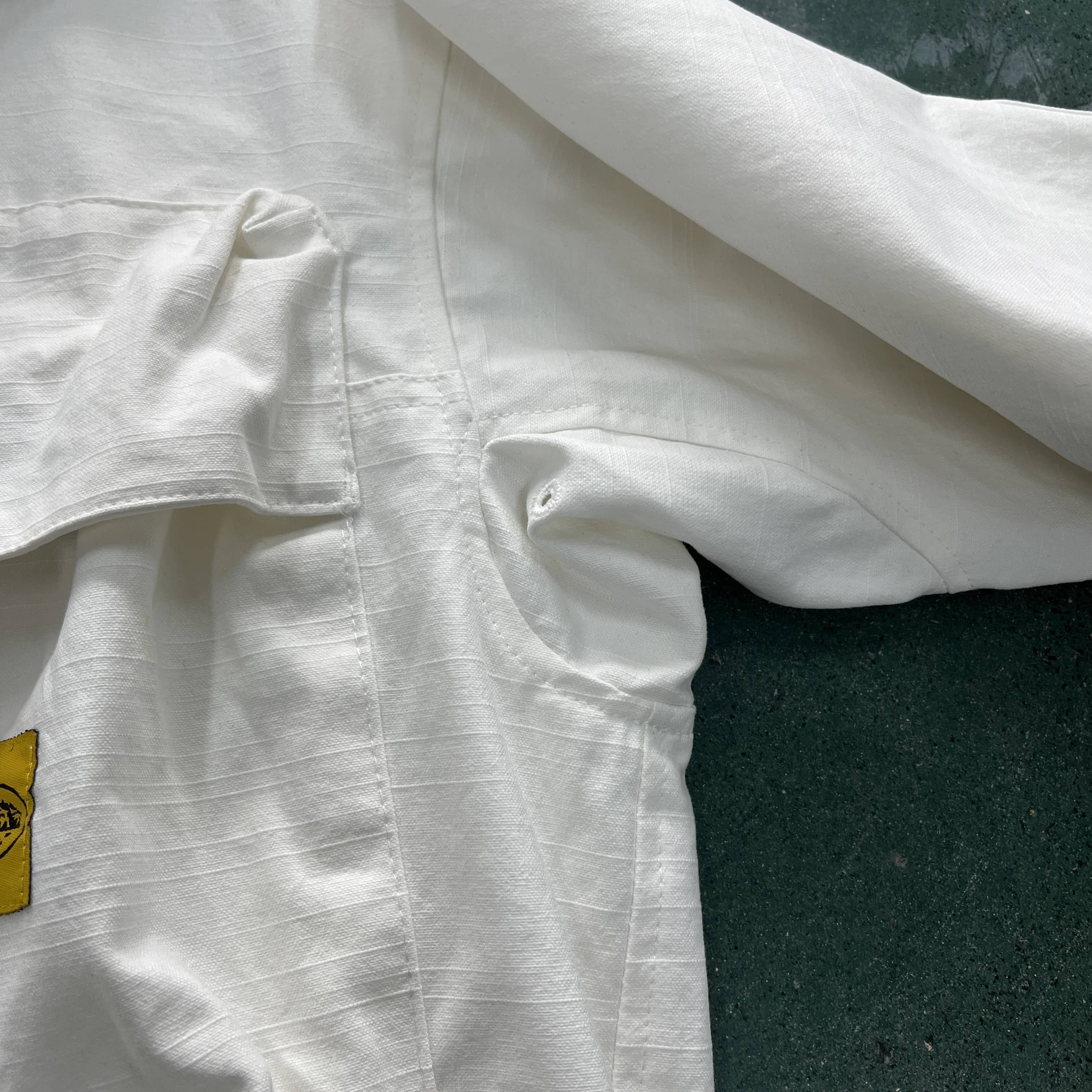 Slant pocket white jacket