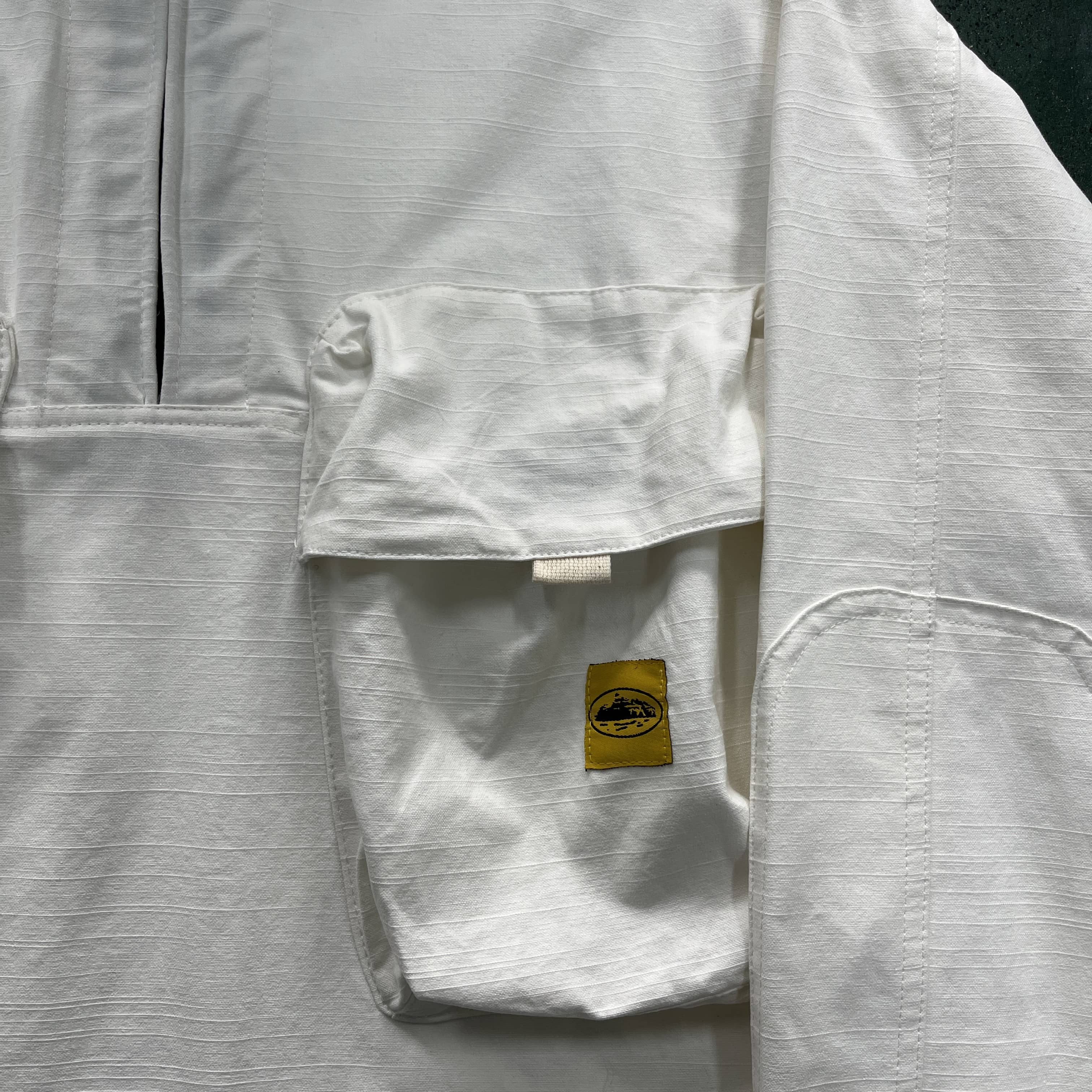 Slant pocket white jacket