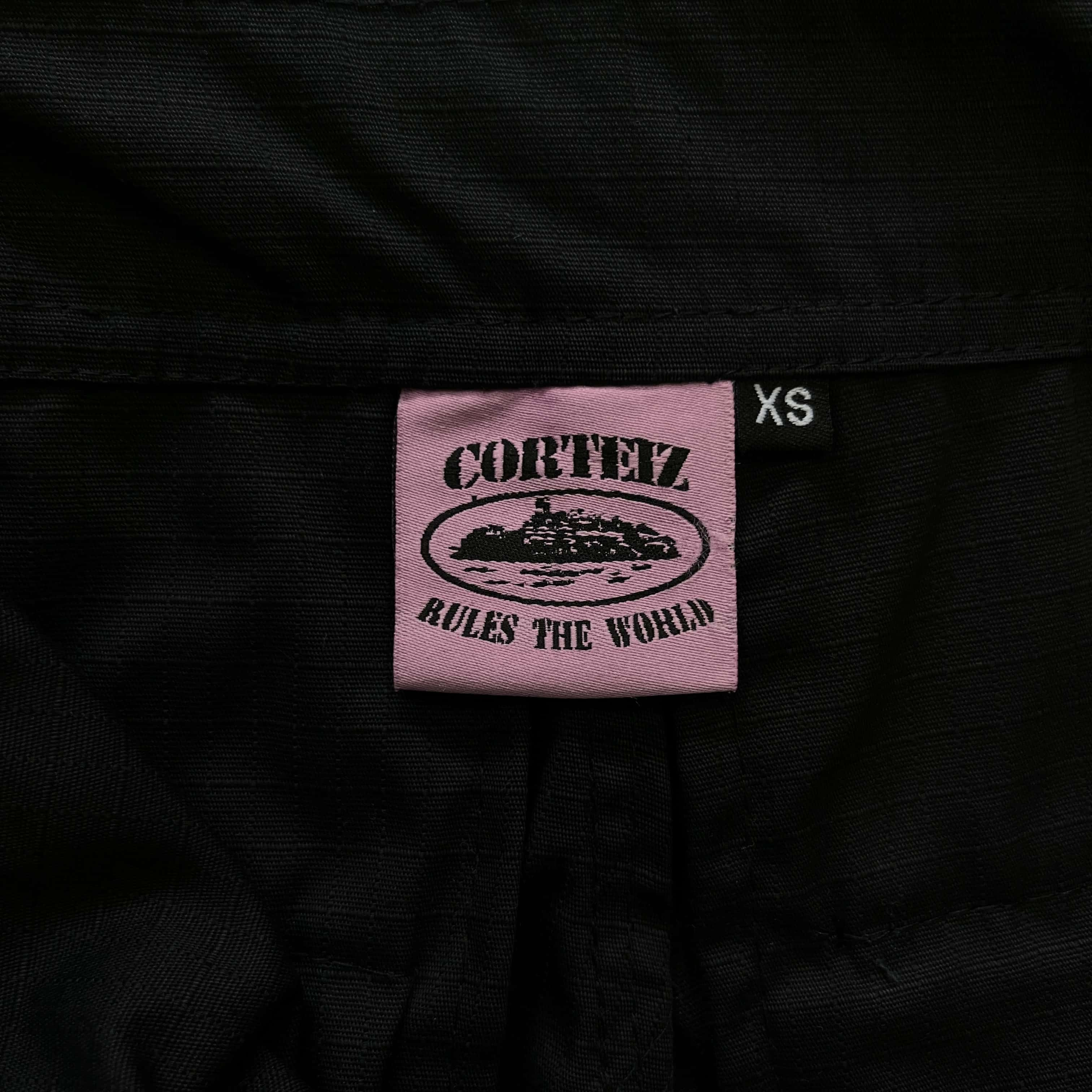 black with pink logo cargos