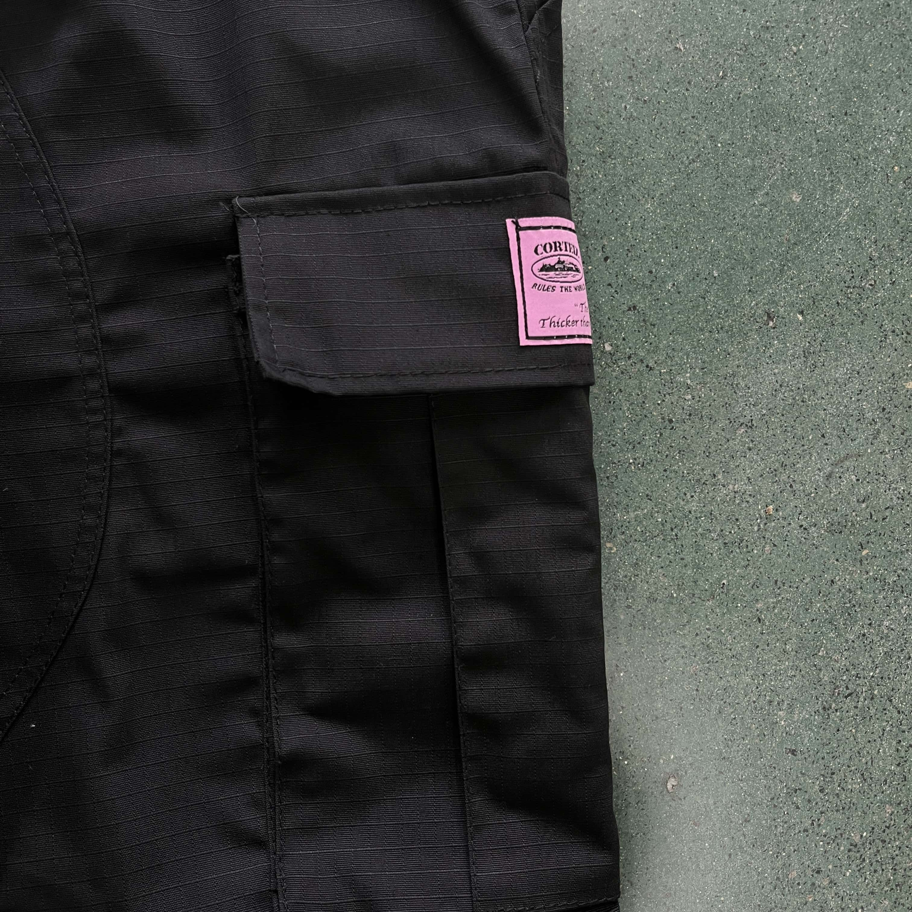 black with pink logo cargos