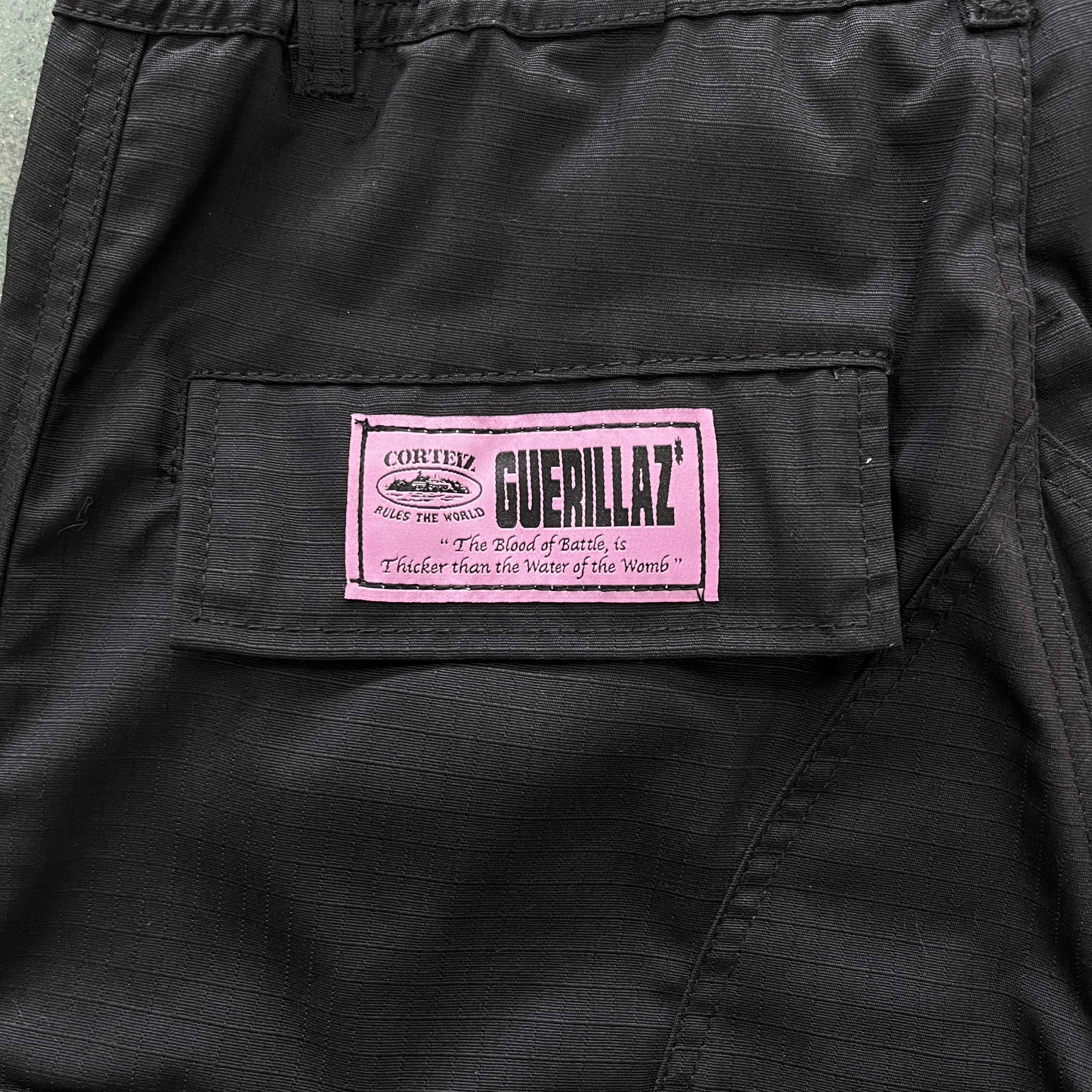 black with pink logo cargos